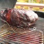 Smoking a pork shoulder on a charcoal grill