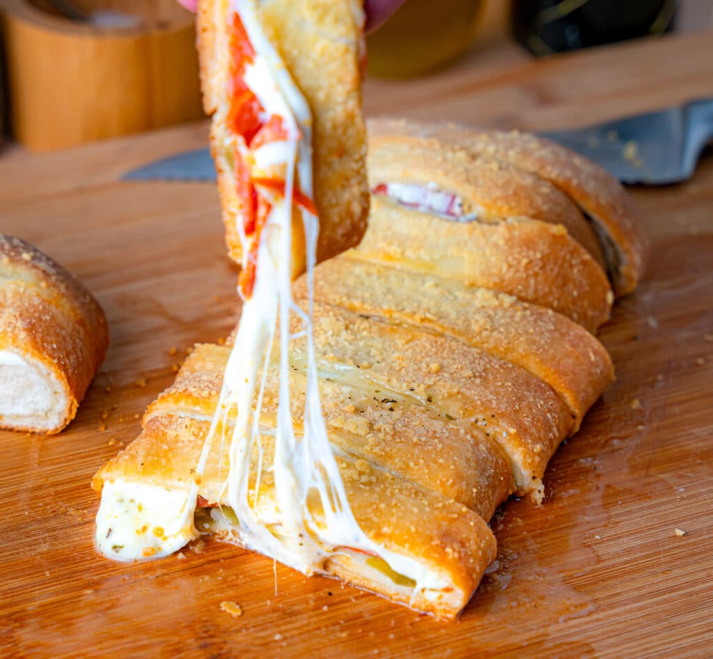cheese pull on  pepperoni roll