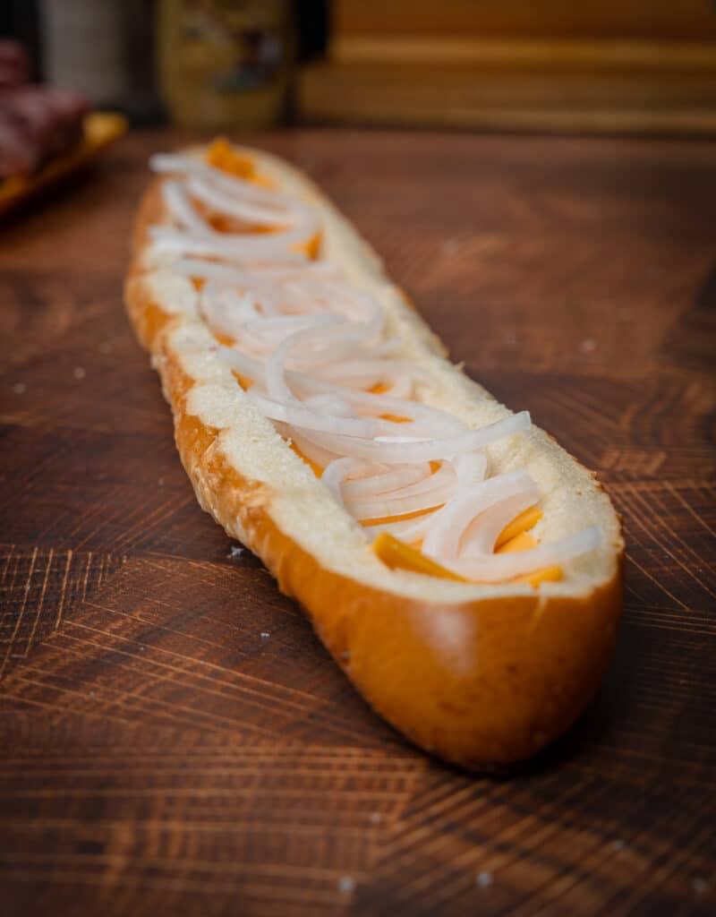 hollowed out French bread with onions and cheddar cheese