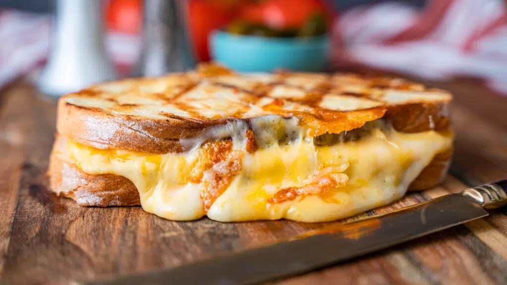 grilled cheese sandwich on a cutting board 