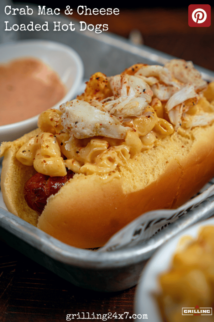crab meat and Mac and cheese on top of a hot dog