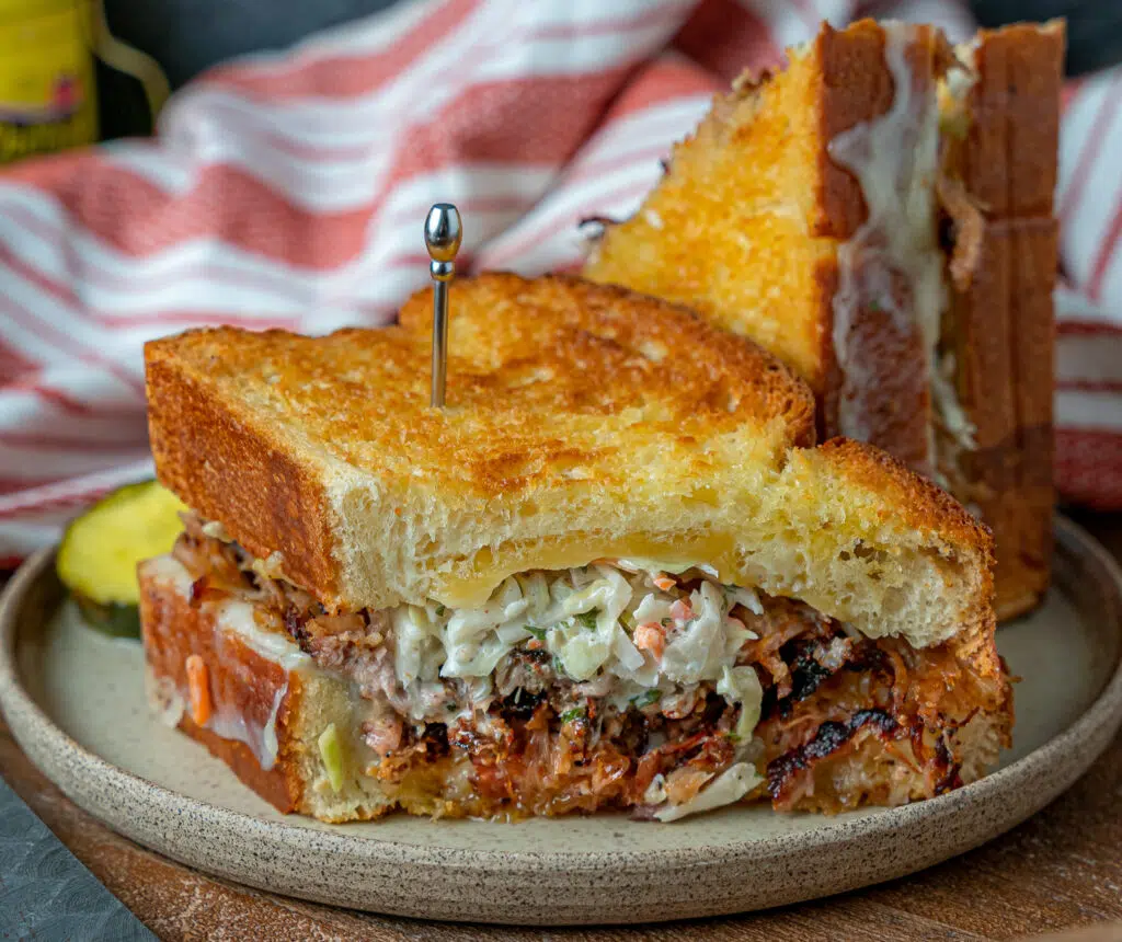 pulled pork grilled cheese with pickles and coleslaw