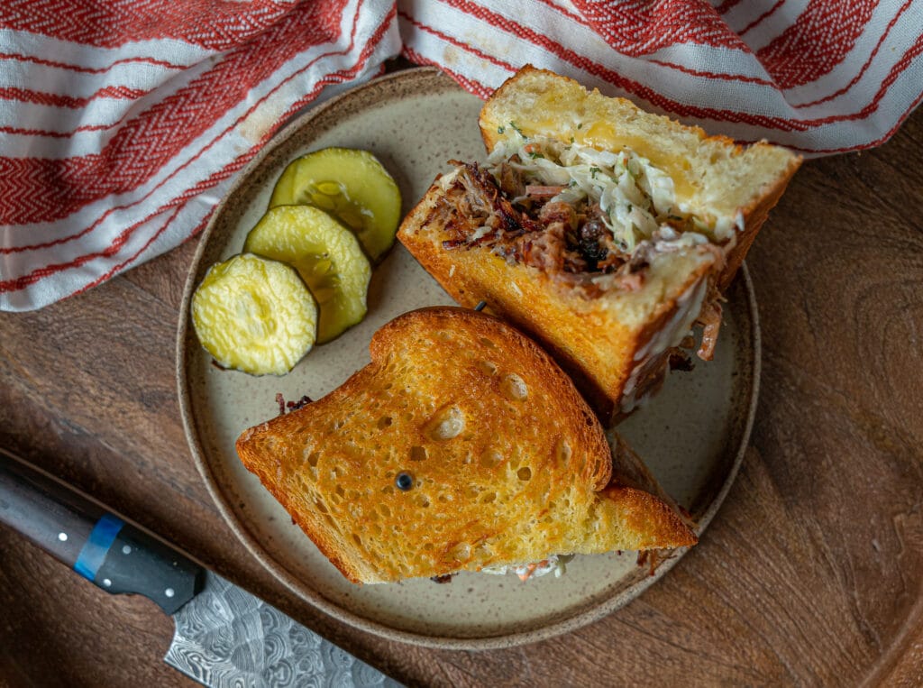 overhead pic of pulled pork grilled cheese with pickles