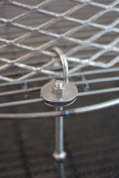 Attaching an expanded steel basket to a charcoal grate for a BBQ smoker - Ugly Drum Smoker Build - Grilling24x7.com