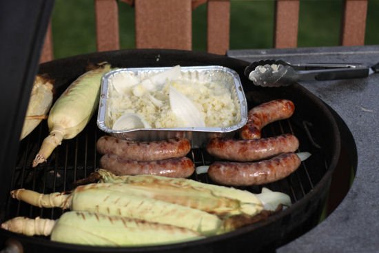 brats and corn on the grill