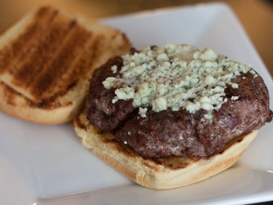 A blue cheese burger on a WSM being used as a high heat charcoal grill - Grilling24x7.com