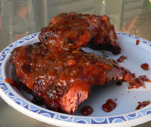 homemade barbeque ribs smoked on a charcoal grill