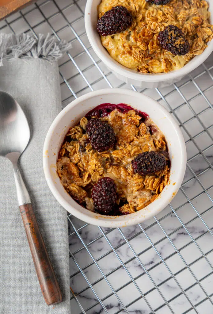 baked oatmeal in a ramekin with blackberries