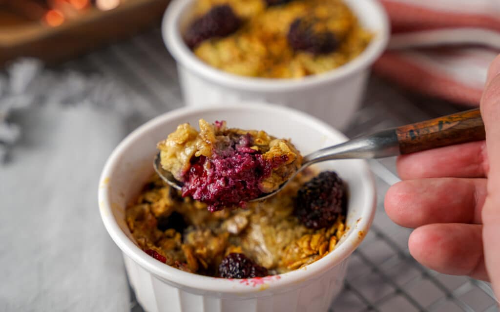 scooping out blackberry baked oatmeal