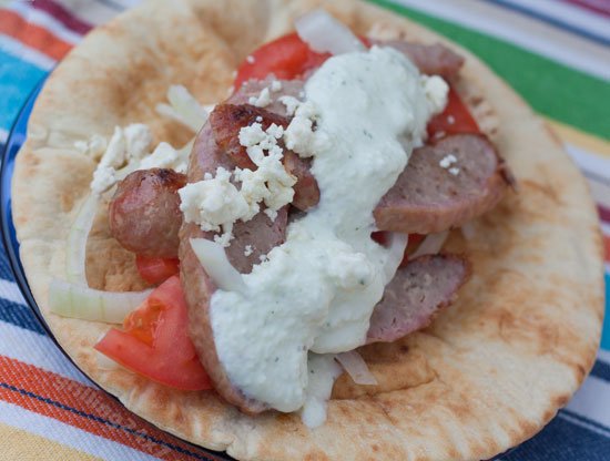 close up of Bratwurst gyro with homemade tzatziki sauce