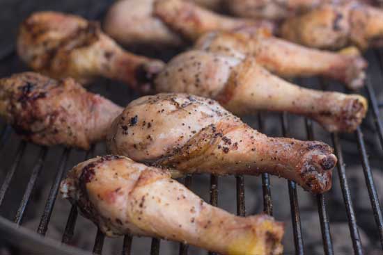 Smoking marinated chicken drumsticks.