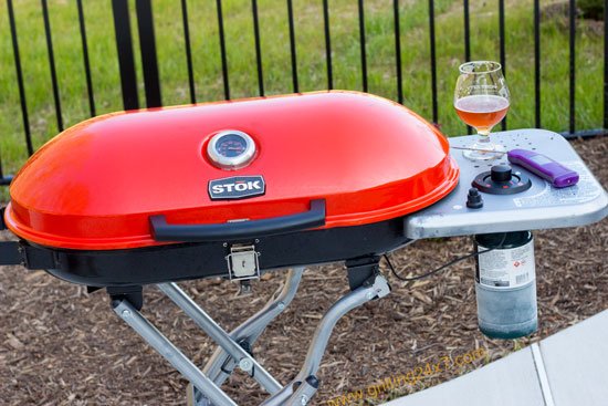 Grilling a steak on a small tailgate grill - Stok Gridiron Review