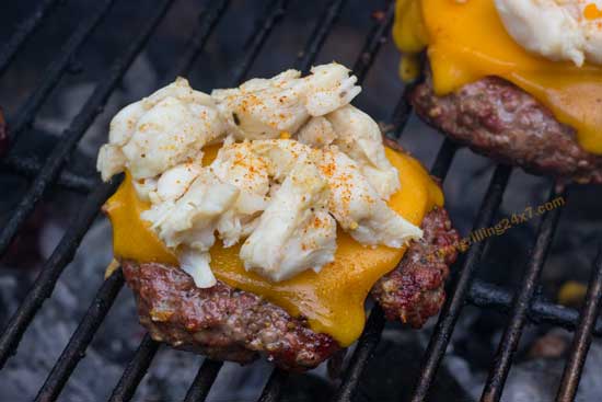 Jumbo Lump Crab Burger Recipe - Lump crab meat with Old Bay on top of a juicy charcoal grilled cheeseburger.