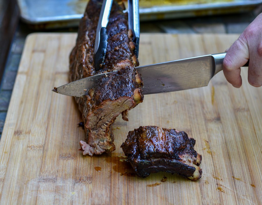 Baby Back ribs cooked on a charcoal grill