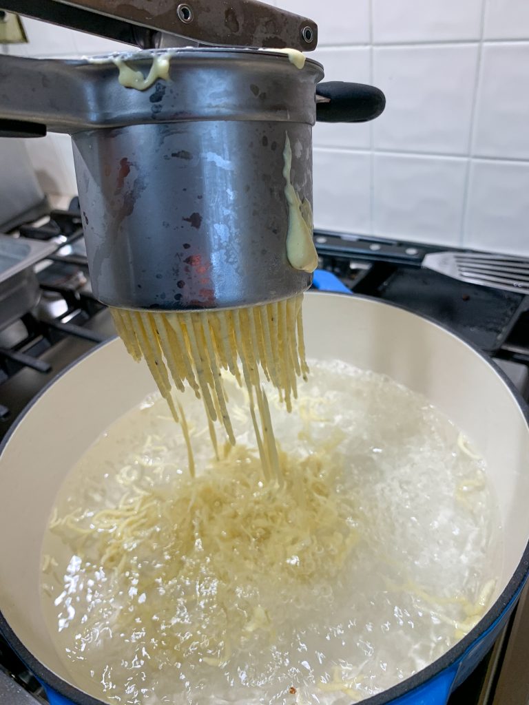 making spaetzle using a potato ricer