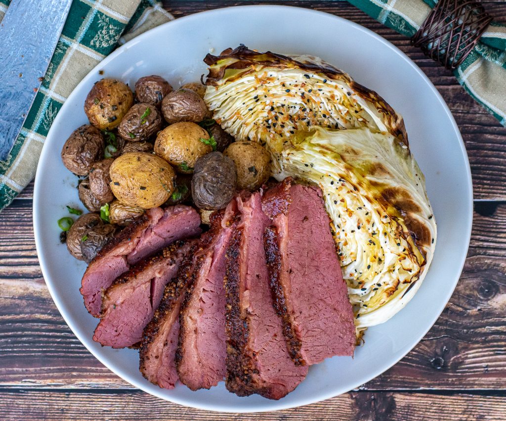 smoked corned beef with braised butter cabbage and cast iron roasted potatoes