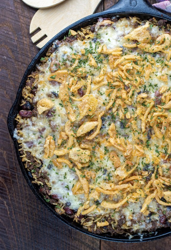 cast iron skillet french onion rice & beans topped with crispy onions