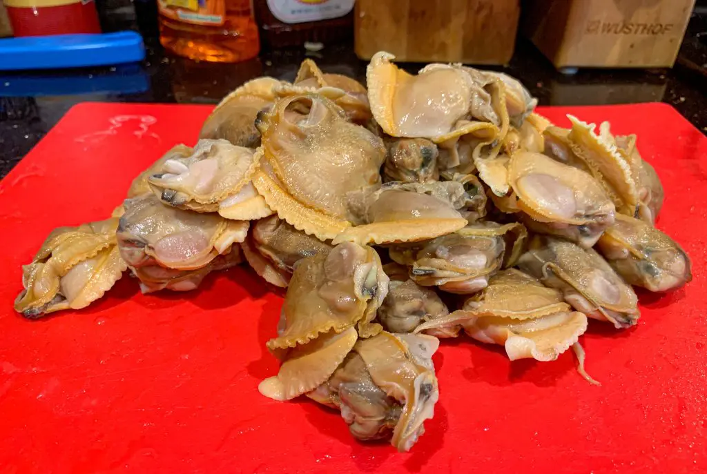 cherrystone clams out of the shell about to be chopped for clams casino