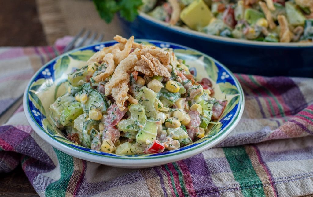 summer side dish for and avocado summer salad with crispy fried onions