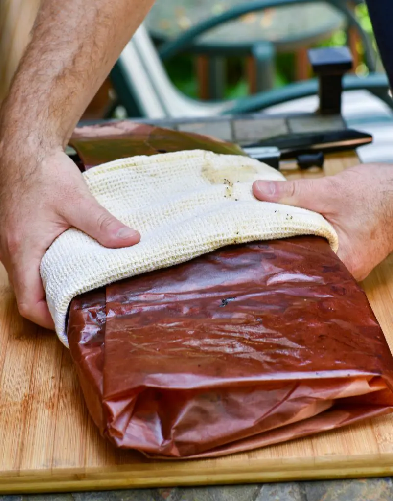 smoked beef brisket wrapped in peach butcher paper