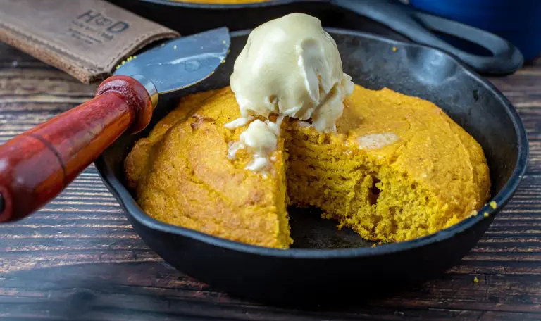 Pumpkin Cornbread with bourbon maple butter in a cast iron skillet