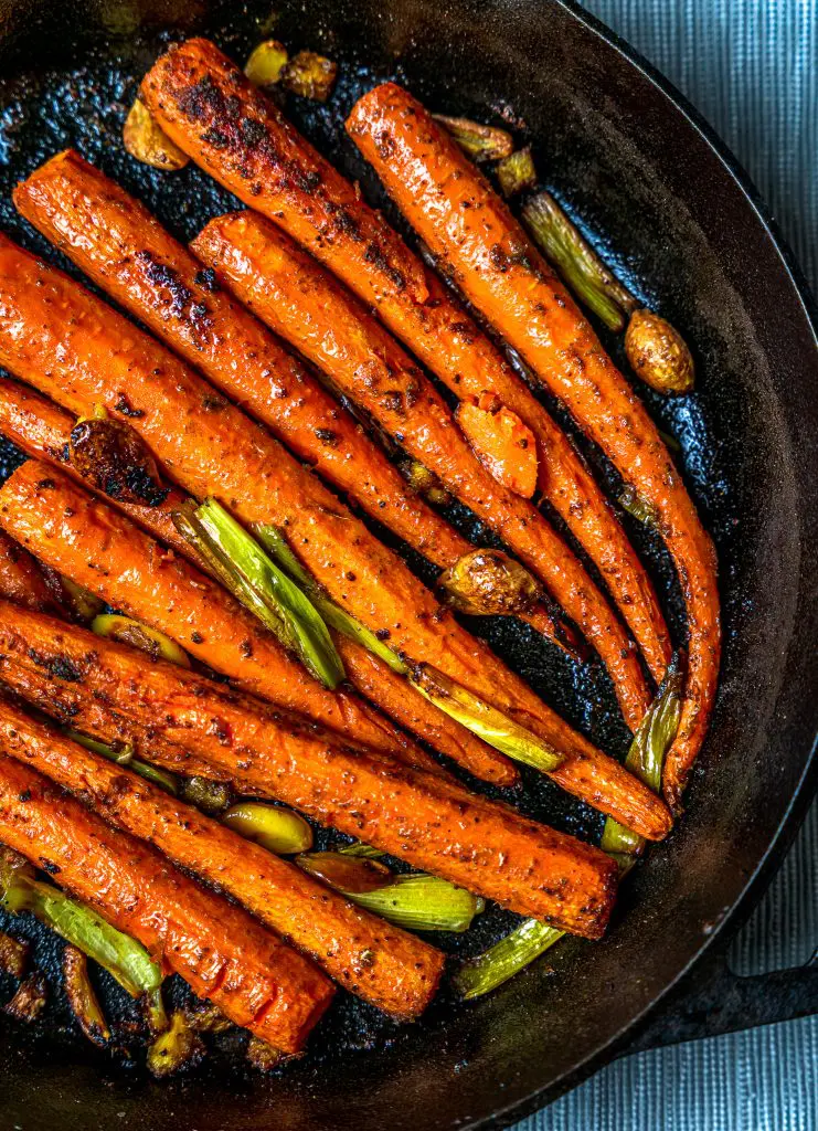 roasted carrots in a cast iron skillet
