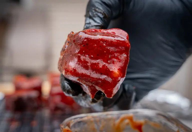 pork belly burnt ends dipped in bbq sauce