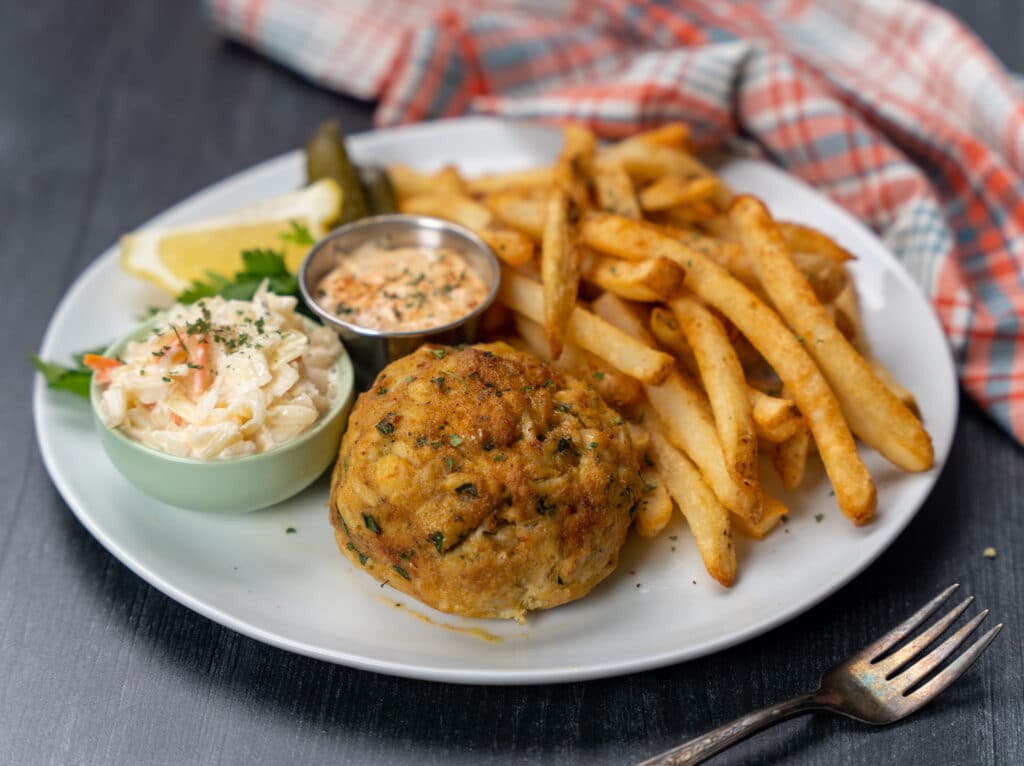 maryland crab cake with fries and coleslaw