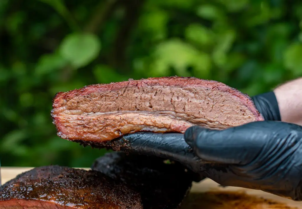 Sliced brisket exposed to show beautiful smoke ring