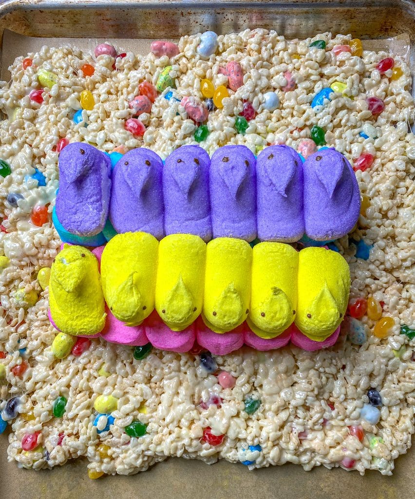 pees marshmallow candy on a sheet od Rice Krispies with jelly beans and other easter candy.