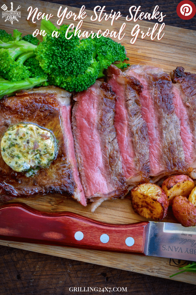 New York strip steak sliced and served with broccoli and garlic compound butter