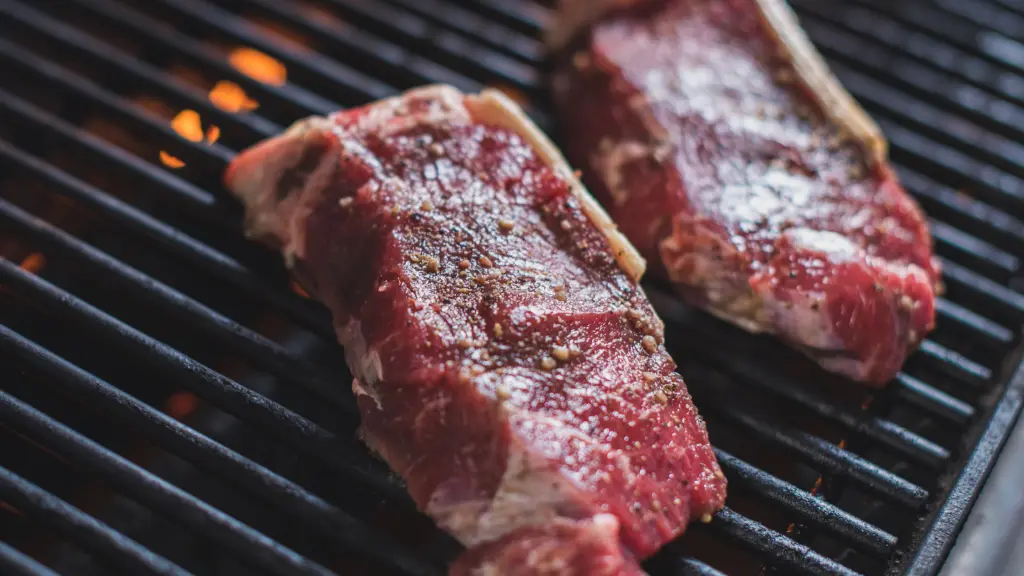 New York strip steak on a charcoal grill