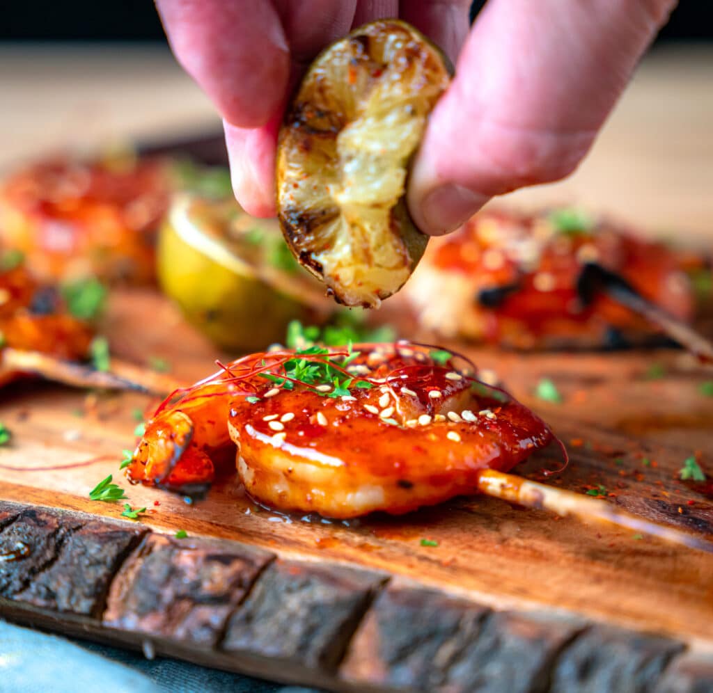 charred lime squeezed on bbq shrimp