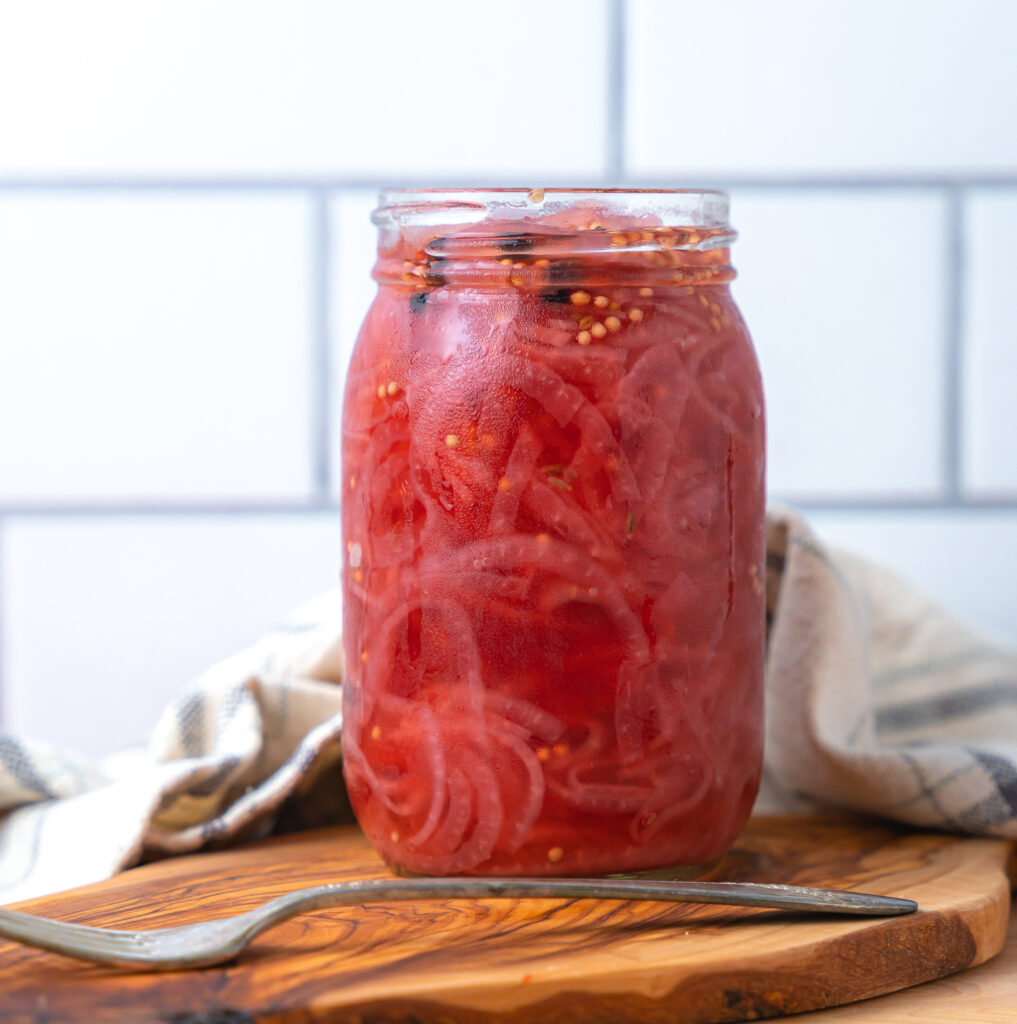 quick pickled red onions in a Mason jar