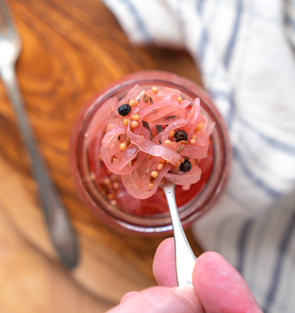 pickled red onions with mustard seeds, celery seeds and peppercorns