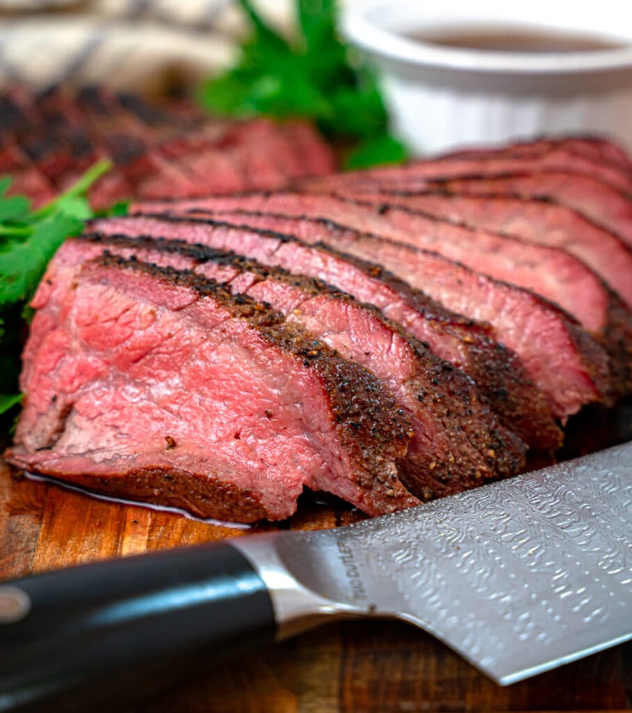 sliced smoked Tri Tip on a cutting board