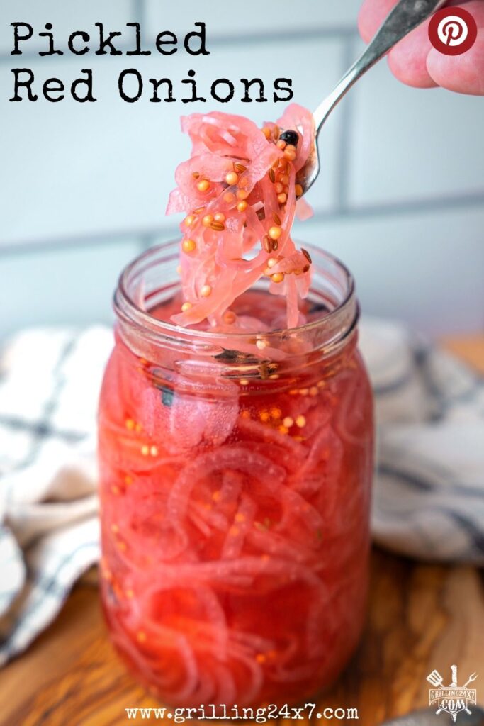 pickled red onions scooped with a fork