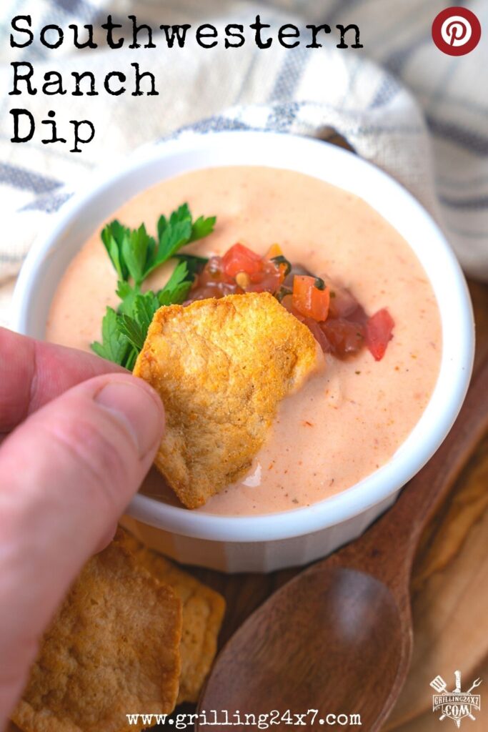 dipping a tortilla chip into the southwest ranch dip