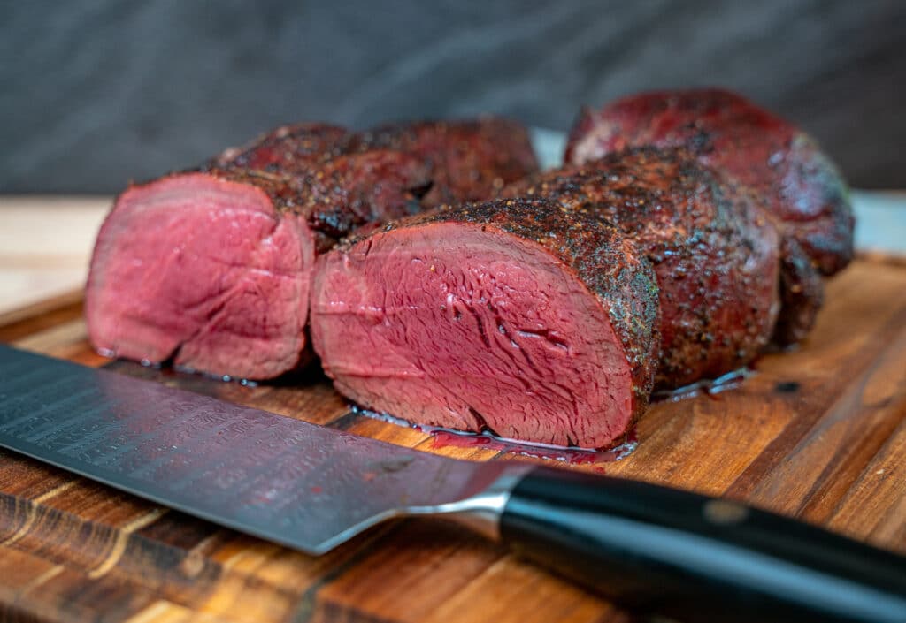 beef tenderloin sliced on a cutting board