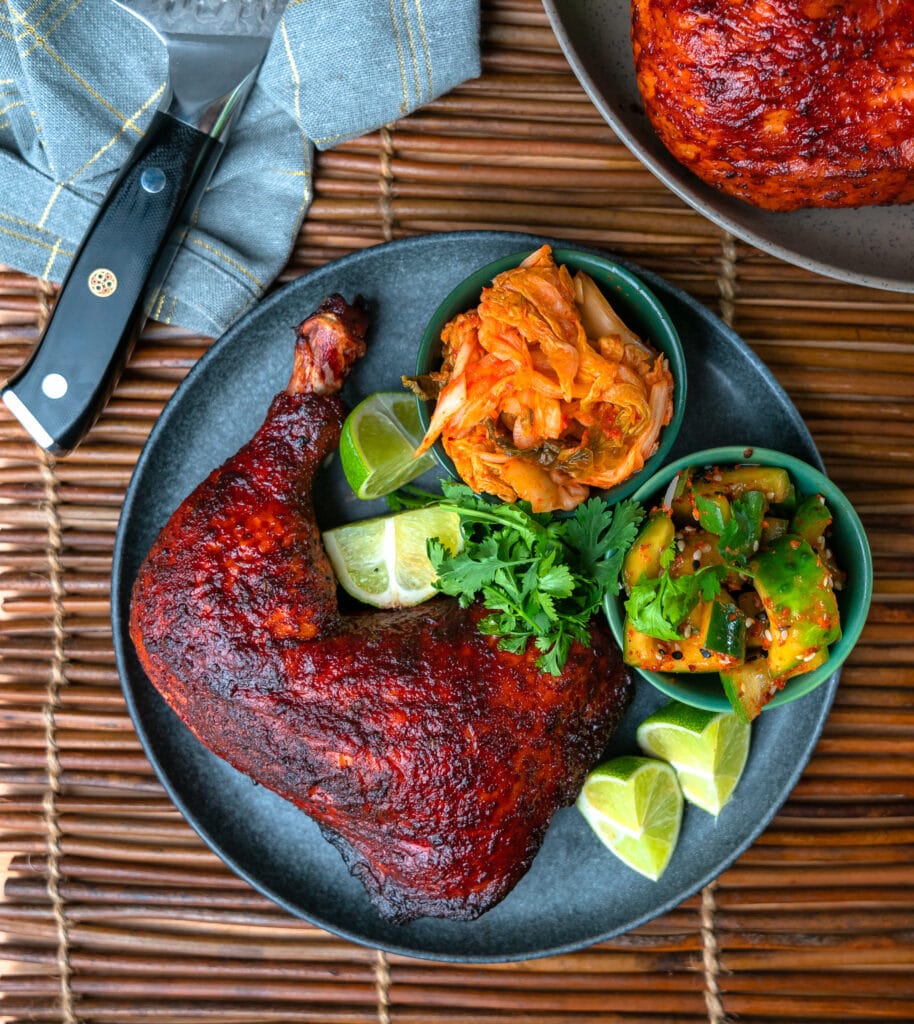 smoked chicken leg quarter with kimchi and Korean pickles