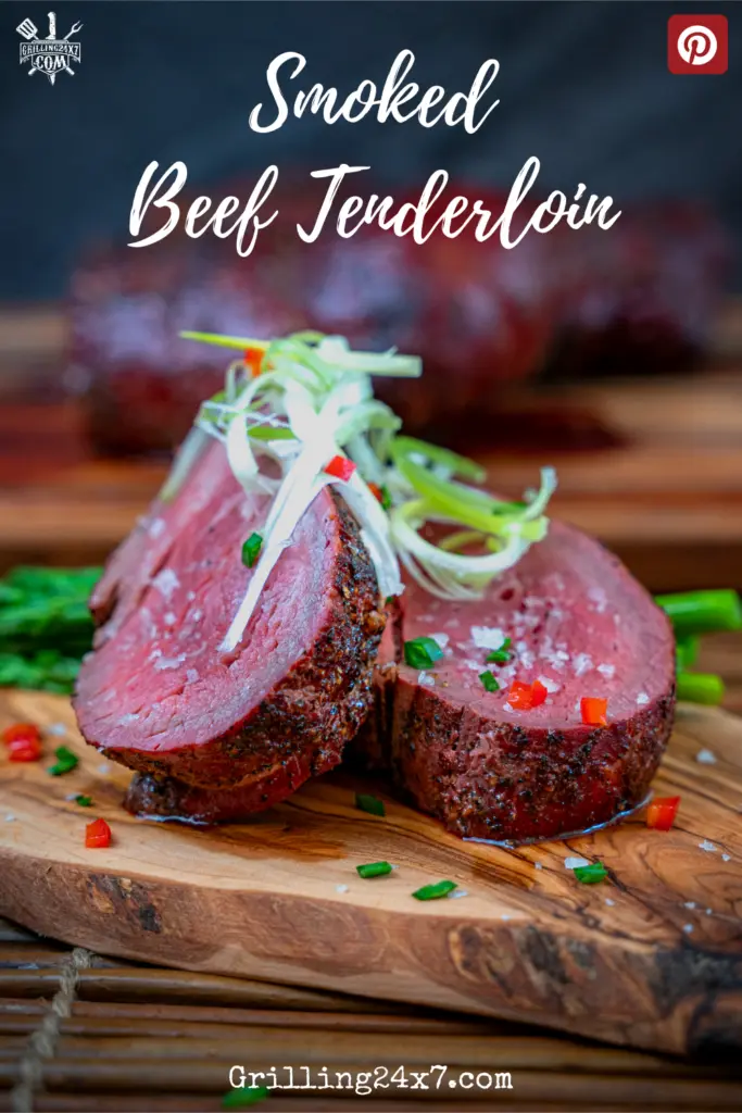 Smoked beef tenderloin on a cutting board sliced medium rare