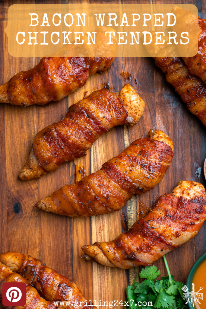 bacon wrapped chicken tenders cooked and served on a cutting board