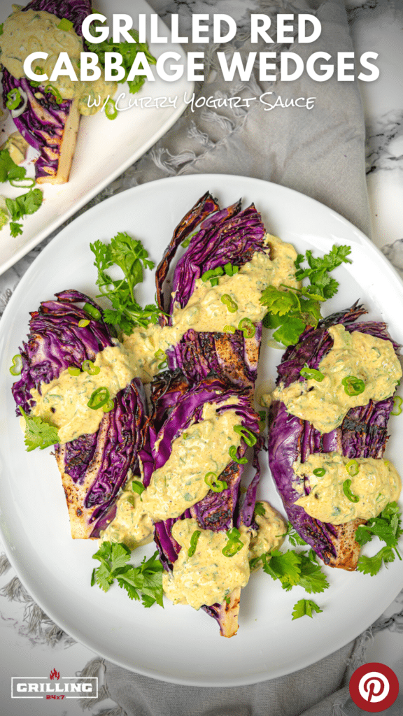 grilled red cabbage wedges with curry sauce on a platter 