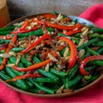 green beans almandine on a tray with a red napkin