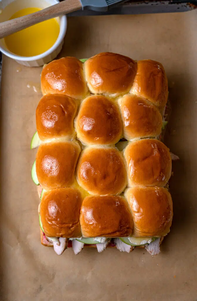 turkey sliders topped with melted butter