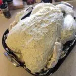 whole turkey covered in compound butter