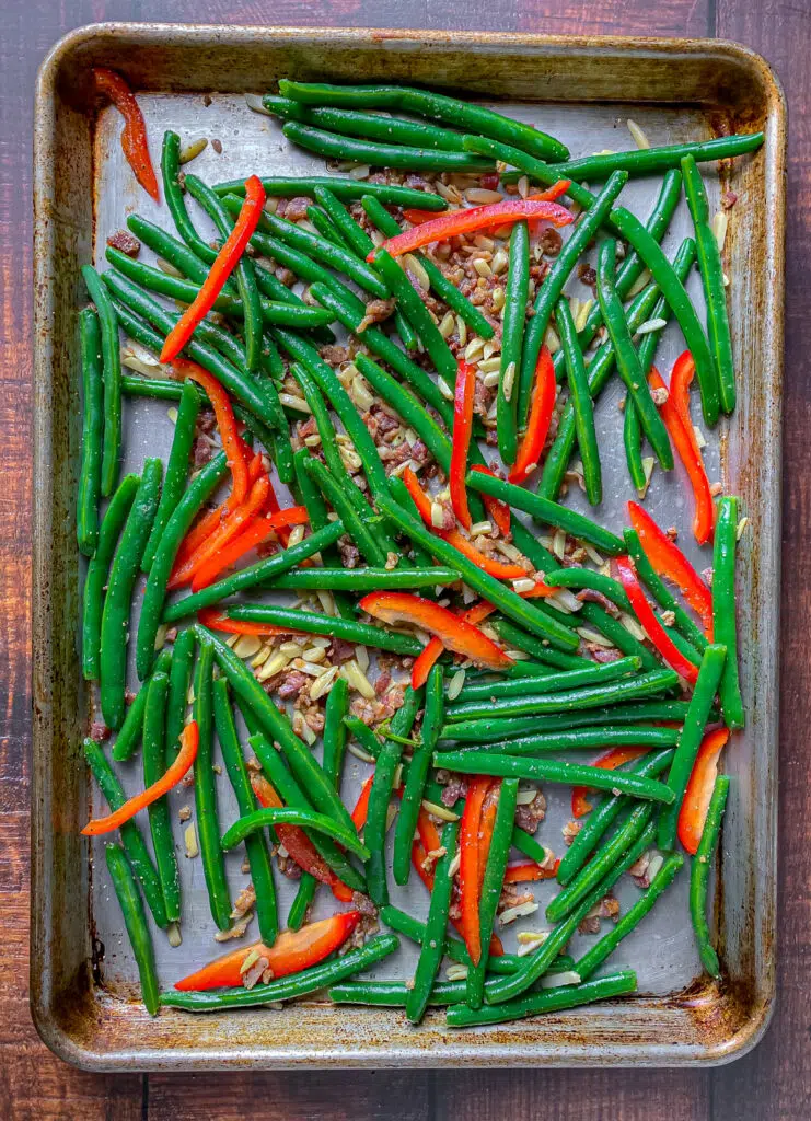 green beans almandine with bacon on a sheet pan