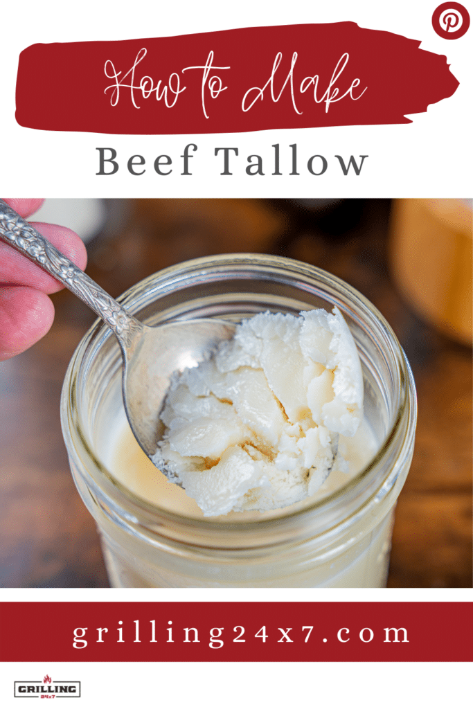 Beef tallow in a mason jar scooped out with a spoon
