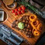 t bone steak with compound butter and onion rings