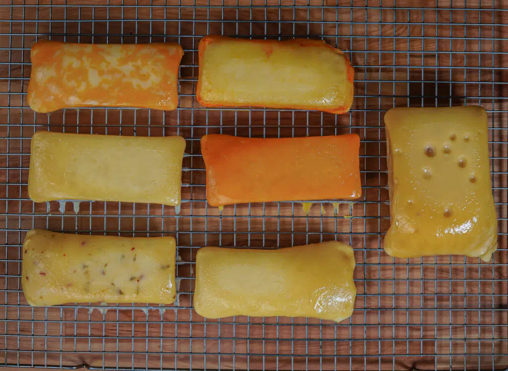 smoked cheeses on a cooling rack